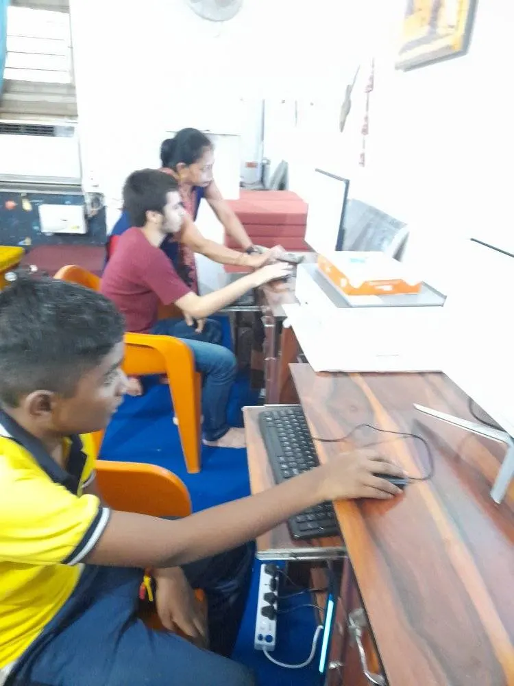A student practising at a computer during a digital literacy session