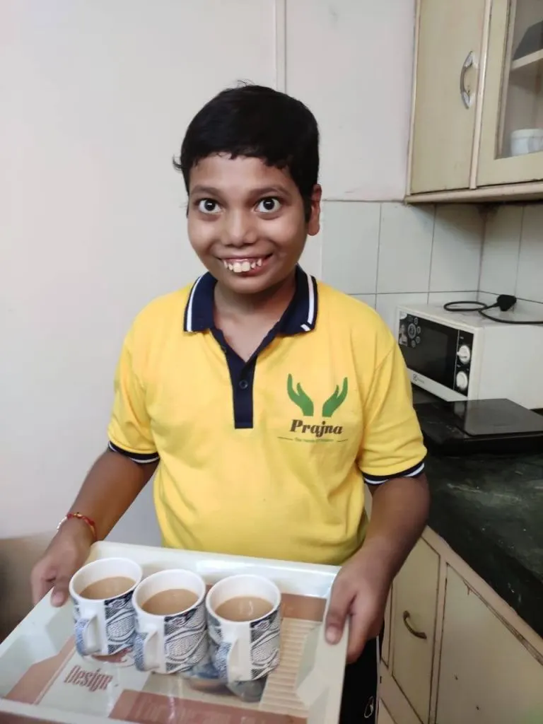 A student practising day-to-day living skills with staff support
