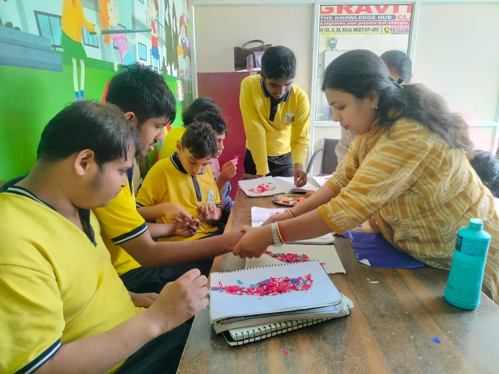 A teacher guiding students through a vocational activity